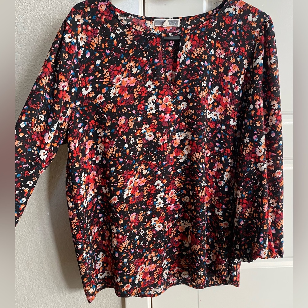 Floral blouse with triangle cut out